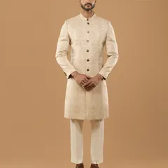 A full front view of our classic ivory sherwani. The clean lines, mandarin collar, and precise tailoring demonstrate our focus on creating a powerful and elegant silhouette for wedding ceremonies.