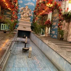 A view of the water feature and Ganesha statue at the grand naming ceremony venue. My decorations are designed to complement and enhance the existing architecture of the space.