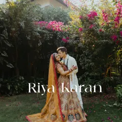 A romantic portrait of a couple in a lush garden on their wedding day, capturing a quiet moment of love after the ceremony.