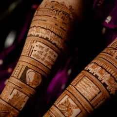 Another view of the forearm with personalized panels. Here you can see a beloved pet's face and a special verse, making the bridal mehendi a true reflection of the bride's life.