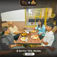 Here's our unique promise: your kids play while you relax. This family is enjoying a fresh, delicious meal from our restaurant, Hing, with a full view of the play area. It's the perfect setup for a stress-free family outing.