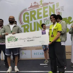 Receiving the prize check for the Green Run. This is the result of consistent training and a refusal to give up, even on tough days.