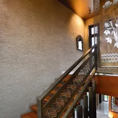 Inspired by the traditional craft of Sanjhi, this laser-cut metal screen and baluster create an innate contextuality while making a contemporary statement. The intricate patterns cast beautiful shadows, adding another layer of detail to the home.