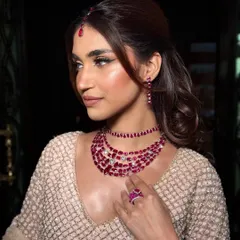 A side profile showing the beautiful highlight and dewy finish of this signature look.