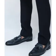 A pair of stylish black leather loafers with a tassel and metal detail. These are a great option to pair with a bandhgala or sherwani for a look that's sharp yet comfortable.