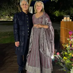 A sophisticated evening look for a wedding guest or family member. This gentleman is wearing a navy blue bandhgala jacket with sequin detailing over a matching kurta set.