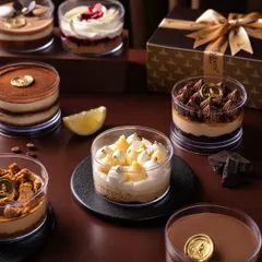 A glimpse into my late-night dessert menu, handcrafted in small batches. From the zesty Lemon Cake to the classic Tiramisu, each dessert tub is a personal treat, also available in a curated gift box.