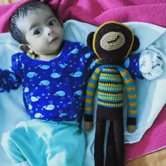 This beautiful photo was shared by a customer. Her little munchkin with the long-legged monkey toy is just the cutest. Thank you for sharing this happy moment.