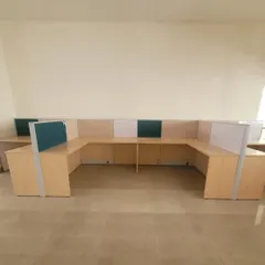 A U-shaped configuration of modular workstations. This setup is ideal for teams that need to collaborate closely while still having their own defined desk space.