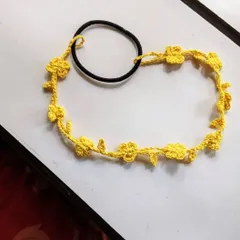 We also offer the floral hairband in bright, happy colors like this sunny yellow. Just let us know what color you'd like for your custom hair accessory.