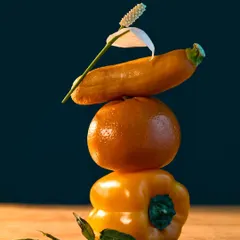 Another piece from my "Fru-Veg" series, this composition balances a bell pepper, an orange, and a zucchini. The play of light and shadow on the vibrant yellow and orange hues creates an abstract, artistic still life.