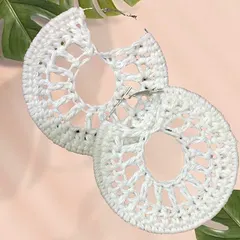A closer look at my white crochet 'Chand Baliyan' earrings. They are a statement piece that's perfect for adding a touch of boho elegance to any outfit.