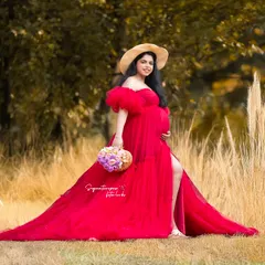 This shot captures a beautiful boho-picnic setup in a field, combining the elegance of the gown with a relaxed, natural vibe.