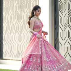 A beautiful shot of the model twirling, her lehenga and jewellery flowing with the movement.