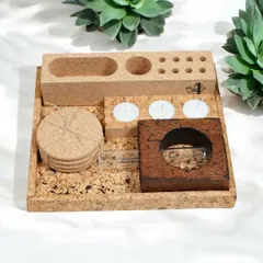 A complete desk organization set made entirely of natural cork. This eco-friendly gift includes a tray, coasters, a tea light holder, and a multi-compartment organizer for pens and stationery.