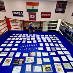 My life's work. Kneeling in the ring surrounded by over 157 certificates and medals I have won since 1997. This is the legacy I pass on to my students.