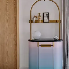 The Gradient Bar, a collaboration with Arjunvir Gujral, brings a playful yet glamorous energy to any space. Its unique gradient finish and delicate gold-arched frame create an alluring focal point for entertaining and celebration.