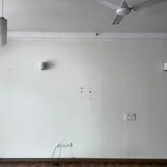 Before: A plain living room wall with basic fixtures. This was the starting point for our 'Cover me in Sunshine' project.