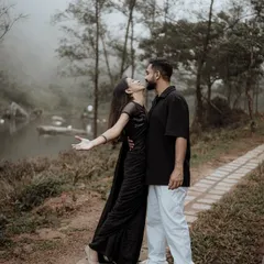 Capturing a candid moment of joy and affection during a pre-wedding shoot. The natural setting and the couple's relaxed interaction result in authentic, heartfelt images.