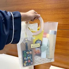 For a beach-themed bridal shower, I curated these tropical gift bags with a personalized tumbler, a luggage tag, and snacks.