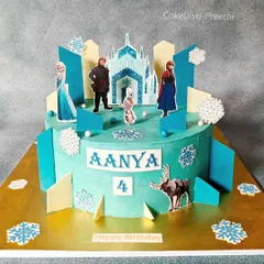 This impressive 5kg single-tier Frozen theme cake is perfect for a big party. It features edible printed toppers of all the main characters, surrounded by chocolate snowflakes and ice shards.