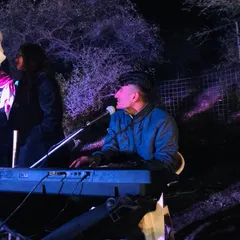 We also feature live music performances at our camps. A musician performs on the keyboard, providing a great soundtrack for a memorable evening with friends.