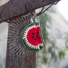 The perfect watermelon slice earrings for when the summer is too hot to beat. These quirky fruit earrings are a fun accessory, handmade with red, green, and white cotton yarn with little black seeds stitched in.