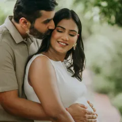 A tender moment during a couple's pregnancy photoshoot. The focus here is on the intimate connection, with natural poses that feel authentic and heartfelt.