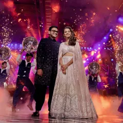A sangeet look that is pure magic. This bride is glowing in a sparkling Manish Malhotra lehenga, ready to dance the night away. The grand entry with disco balls and pyrotechnics perfectly matches the glamorous vibe of her outfit.
