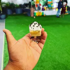 A mini dessert cup, perfectly portioned for a birthday party. We create a variety of bite-sized desserts that are easy for kids to enjoy while they play.