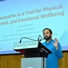 A wider view of my session at Yoga Sangam 2025. The presentation slide shows the topic: "Pranayama as a Tool for Physical, Mental, and Emotional Wellbeing," reflecting my core teaching philosophy.