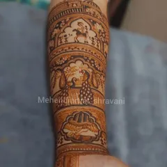 A single arm showcasing a story in bands. This design includes a baraat scene with a groom on a horse, dancing peacocks, and other festive elements.