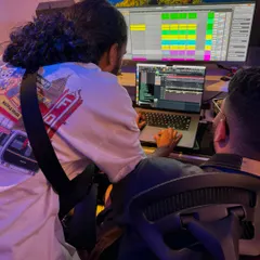 Collaboration is key. Here I am in the studio with another artist, working on a track together. Bouncing ideas off other creative people is one of the best parts of the production process.