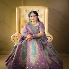 A classic seated portrait of the bride-to-be, showcasing her elegant engagement outfit.
