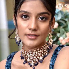 A stunning close-up of a bridal choker set with uncut diamonds and blue sapphire drops. For this campaign shoot, I paired the jewellery with a sequined blue blouse to create a glamorous, modern bridal look.
