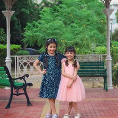 Two sisters, best friends for life. This outdoor portrait was part of a fashion collaboration, capturing their sweet bond in a beautiful park setting.