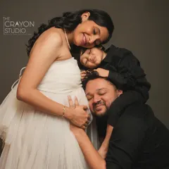 A maternity session is a celebration for the whole family. This tender moment, with their first child and dad listening to the baby bump, is a beautiful story of love expanding to welcome a new life.