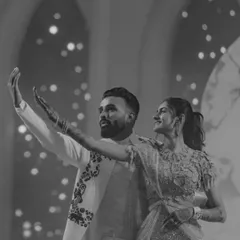 A classic black and white shot of the couple dancing. It captures a moment of grace and connection, proving that elegance is always in style.