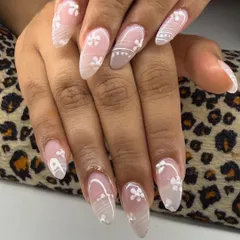 A delicate and romantic floral design. I used a soft, milky white base and hand-painted tiny white flowers and lines for a look that is perfect for a bride.