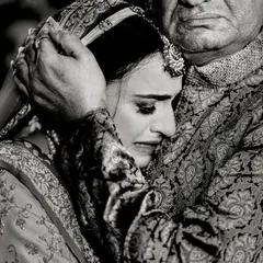 The vidaai, or farewell. A daughter's emotional embrace with her father is one of the most powerful moments of a wedding day. I capture these raw, heartfelt goodbyes with sensitivity.