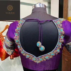 I love creating designs that are both elegant and playful, like this deep purple blouse. The heart-shaped cutout on the back is highlighted with contrasting turquoise and gold embroidery, finished with delicate, handcrafted tassels that add a touch of movement.