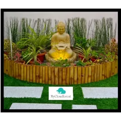 This is a small meditation corner I designed using a Buddha fountain as the centerpiece. The space is enclosed by a natural bamboo border and surrounded by a mix of potted plants, creating a private and serene atmosphere.
