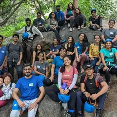 This is our tribe. A smiling, supportive group of adventurers from all walks of life, celebrating a day पुलिस on the rocks. When you join our workshops, you're not just learning to climb; you're finding your people.