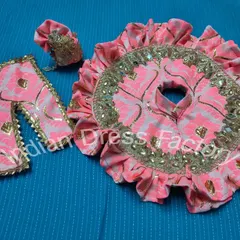 A beautiful pink and gold brocade vastra set for Laddu Gopal. This custom poshak features delicate ruffles and mirror embellishments for a festive look.