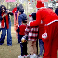 A mother captures a precious moment of her children meeting Santa Claus during our Countryside Christmas event. It's a magical experience for the little ones.