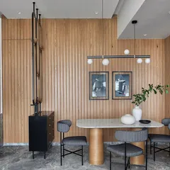 Creating space without boundaries is key in modern homes. This elegant partition in the living room strikes the perfect balance between openness and privacy, separating the dining area while maintaining a sense of connection and flow.