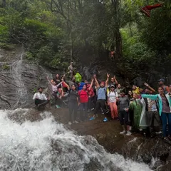 The whole group celebrating together in the refreshing waters of a stream on the Kodachadri trail.