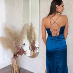 The back of my blue satin corset gown features a delicate criss-cross tie detail. This not only looks beautiful but also allows you to adjust the fit to your body perfectly.