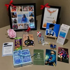 Celebrating a huge milestone with a custom graduation hamper. This gift set includes a Messi-themed canvas, a personalized bookmark, a resin keychain, scented candles, and photo frames to honor the graduate's achievements.