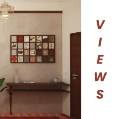 A view from the foyer into the living area, highlighting the transition from the red Athangudi tile flooring to the main living space. The design uses distinct zones to create a sense of discovery as you move through the apartment.